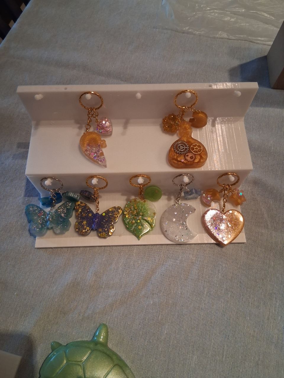 Sunlit Creations handmade resin keychains on display